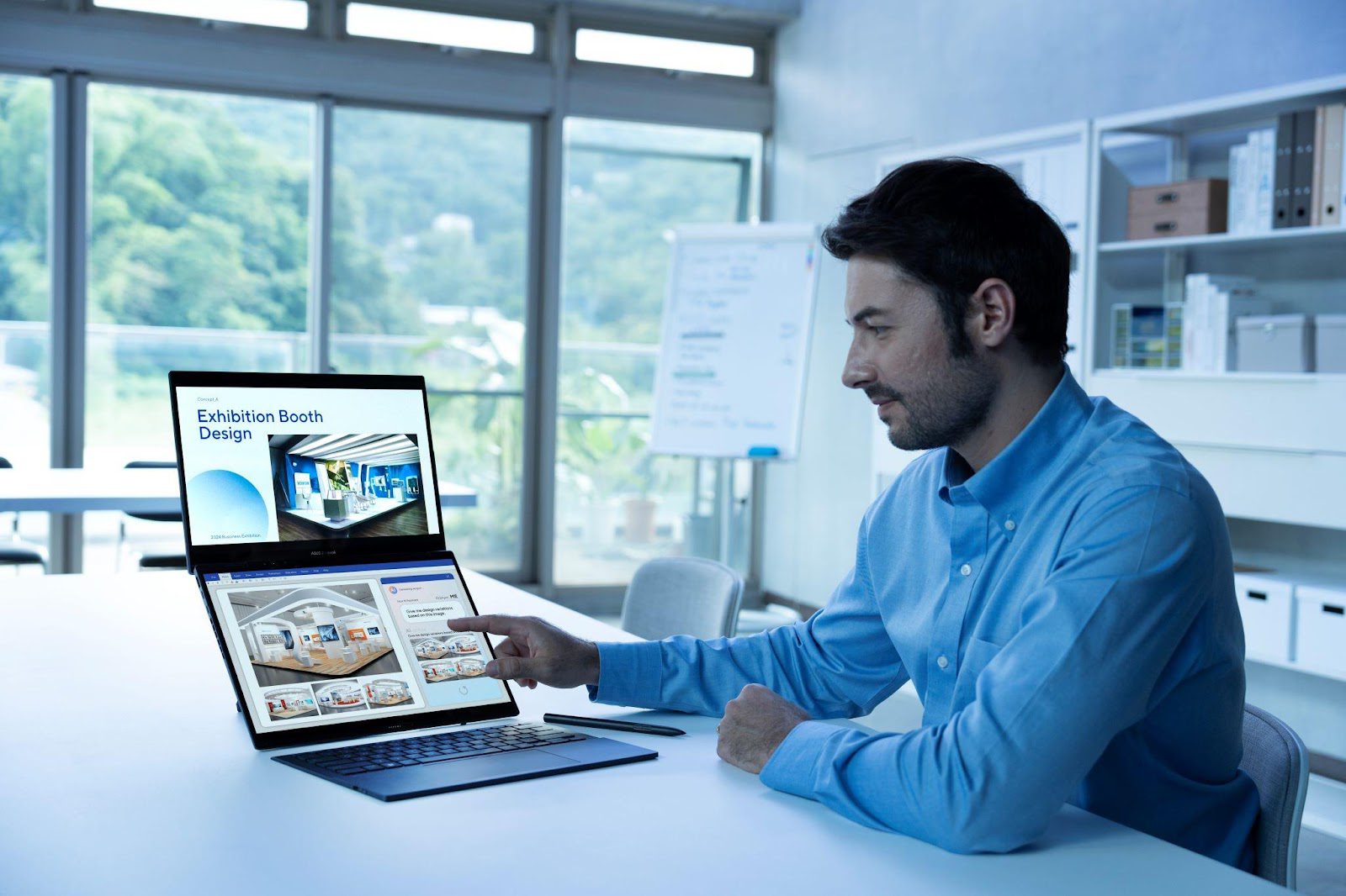A person sitting at a desk pointing at a computer

Description automatically generated