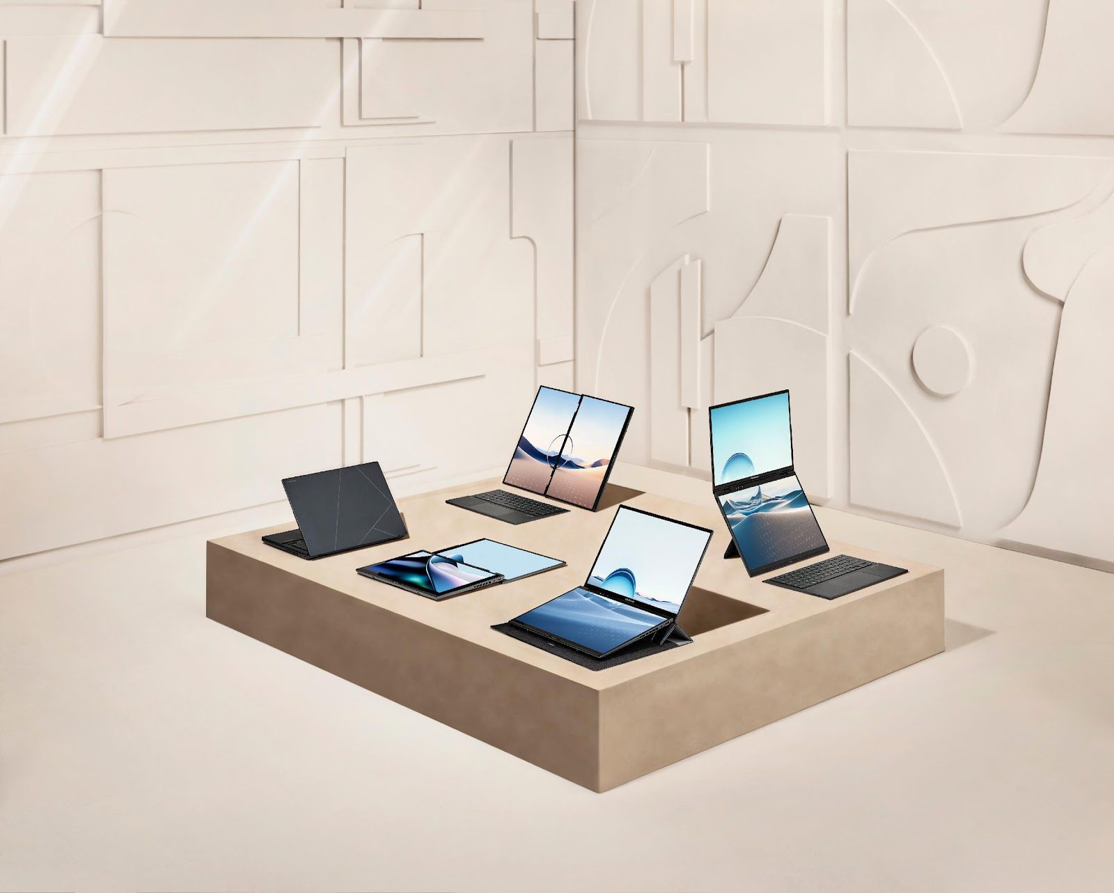 A group of laptops and tablets on a square table

Description automatically generated