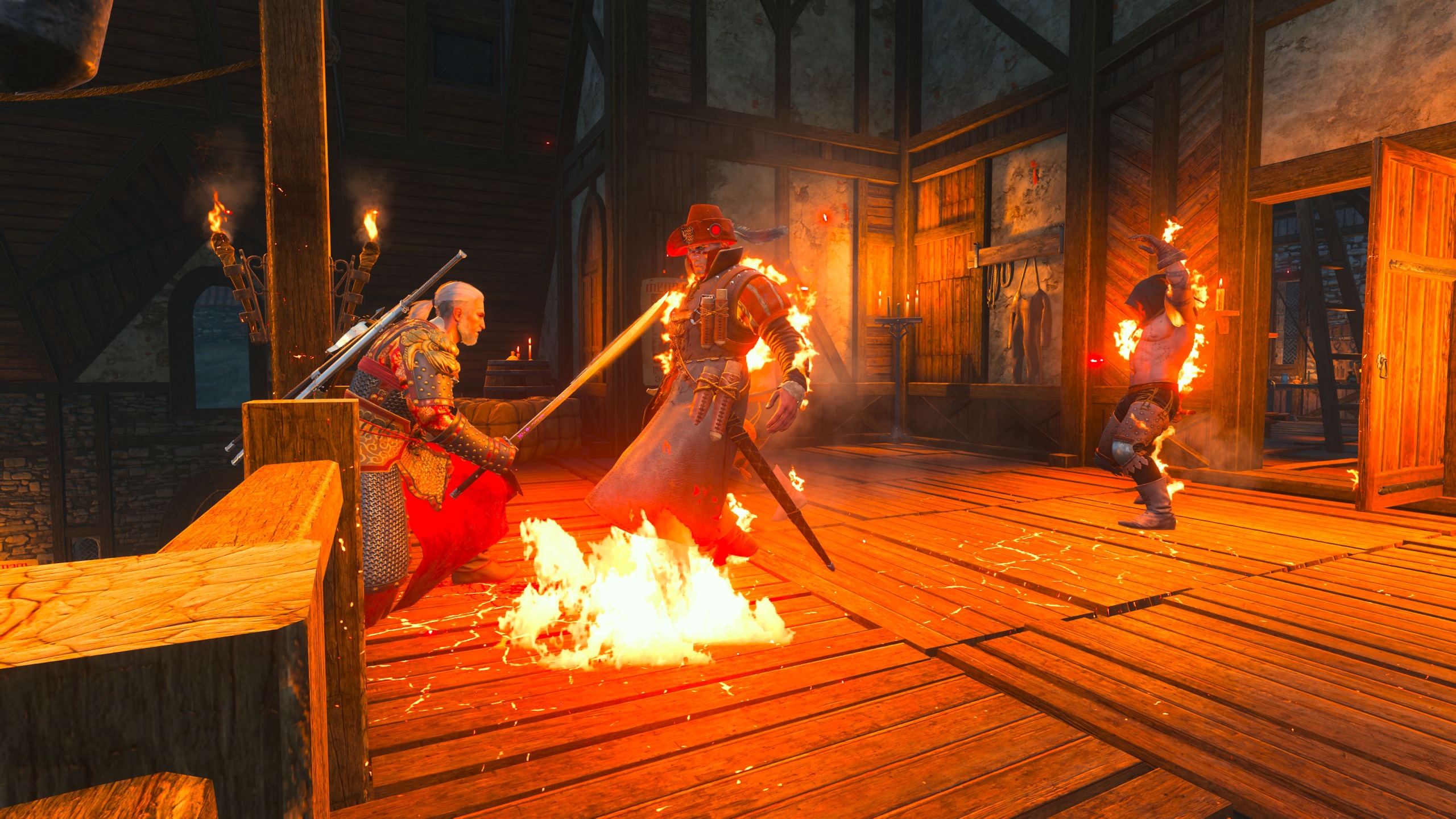 Geralt sử dụng kiếm và phép thuật chiến đấu với kẻ địch đang bốc cháy bên trong căn nhà gỗ.