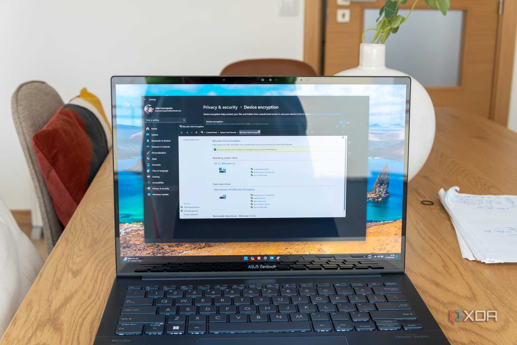 A laptop running Windows 11 showing BitLocker settings