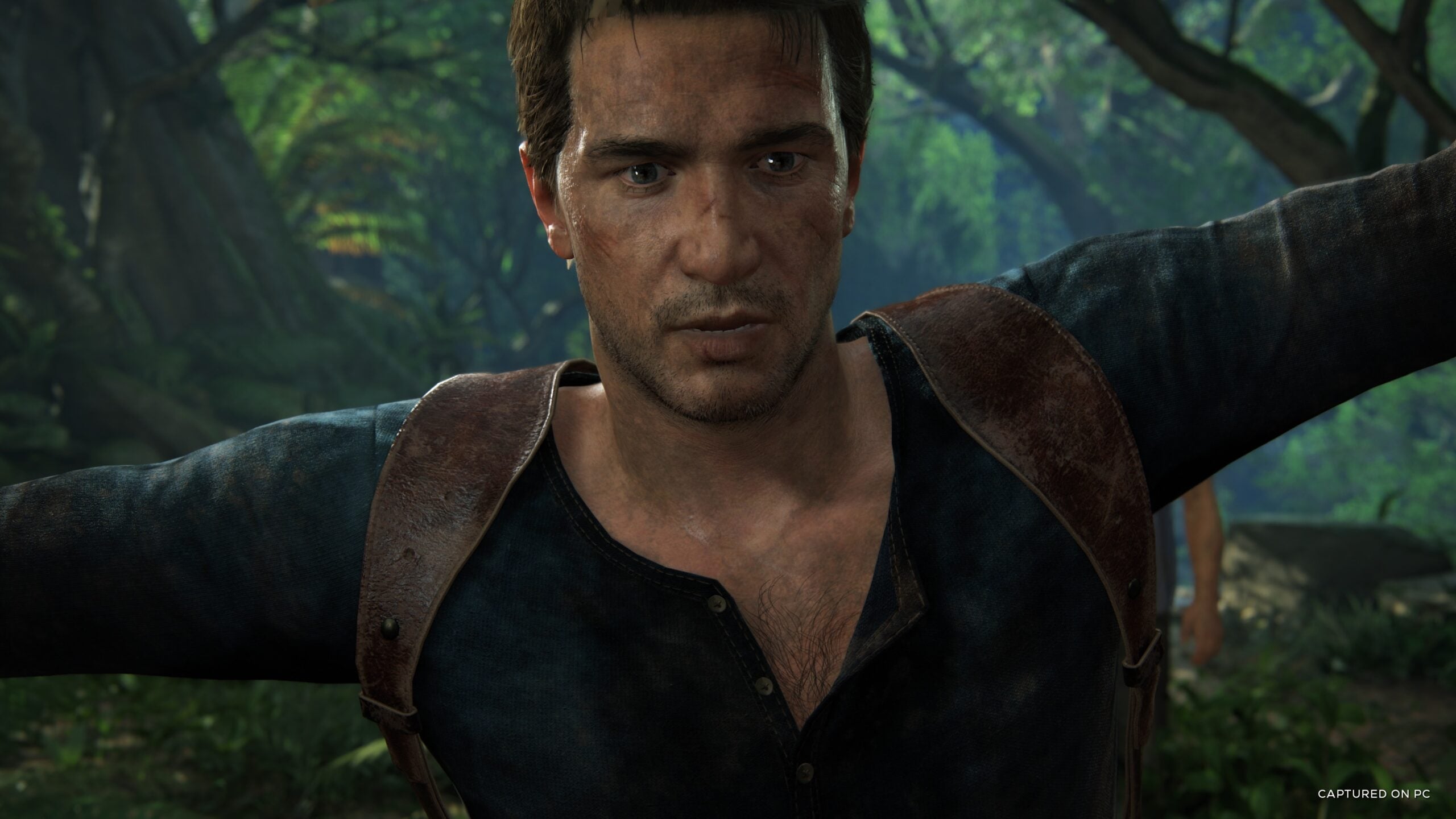 Cận cảnh gương mặt Nathan Drake trong rừng nhiệt đới trên bản PC