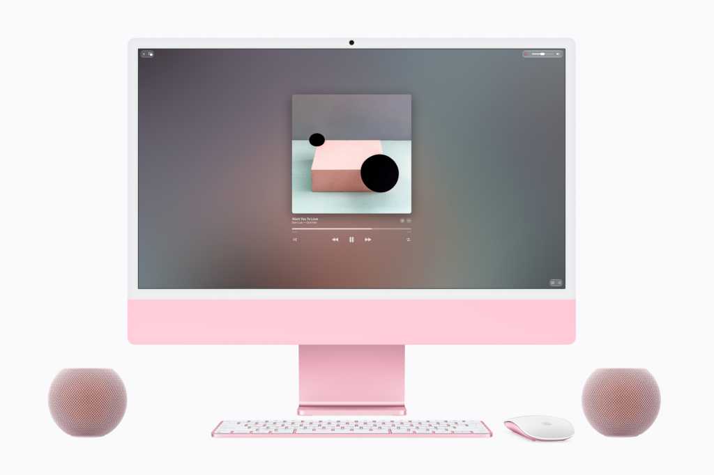 Cặp loa HomePod mini 2 màu hồng đặt cạnh iMac