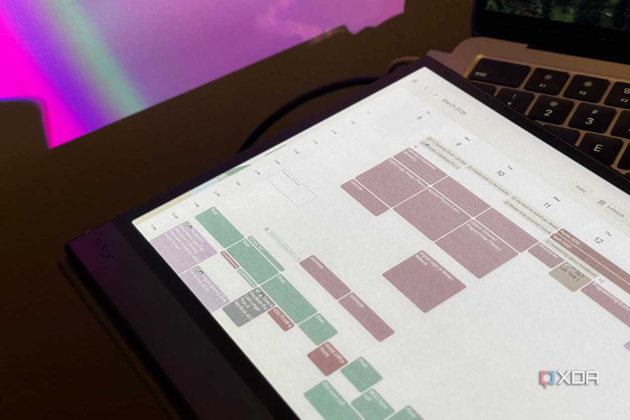Close-up of a Boox tablet's color E Ink screen showing Google Calendar events in March