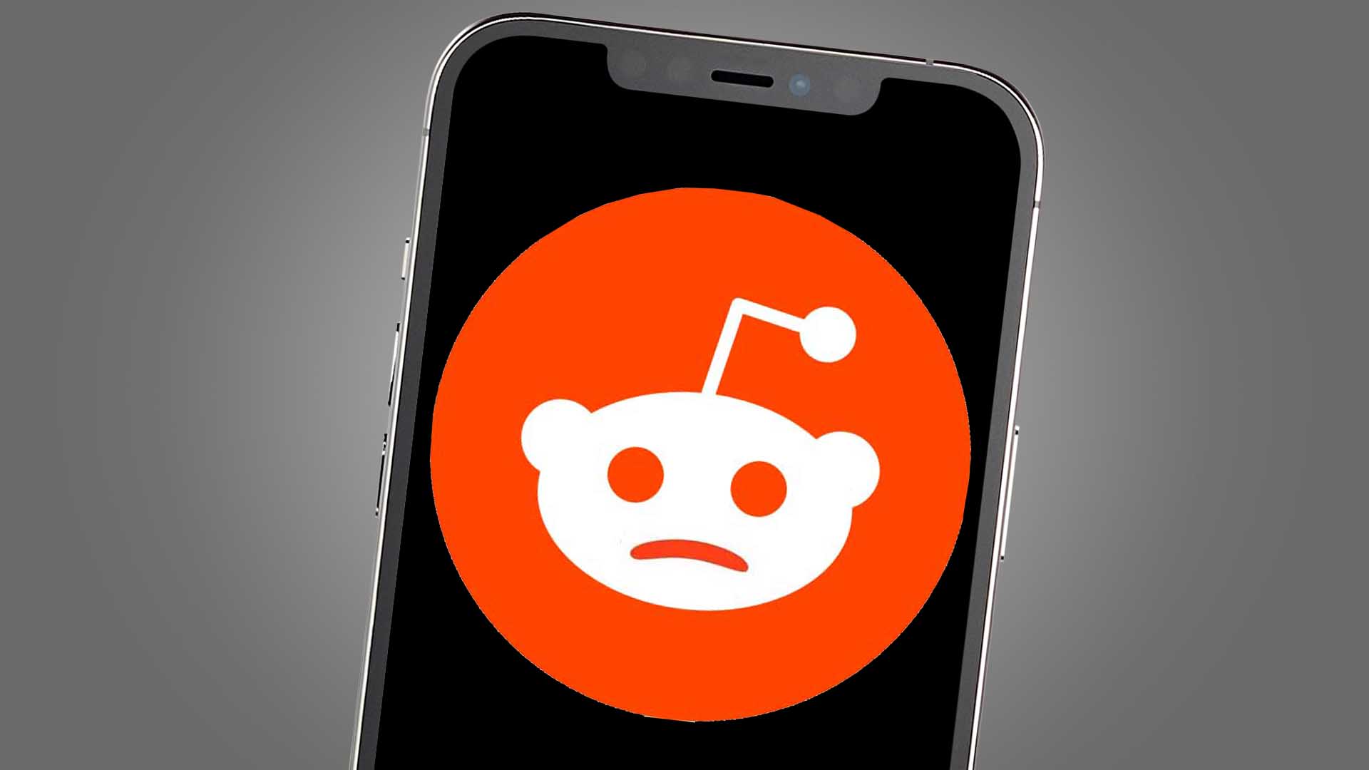 Điện thoại hiển thị biểu tượng Reddit với nét mặt buồn