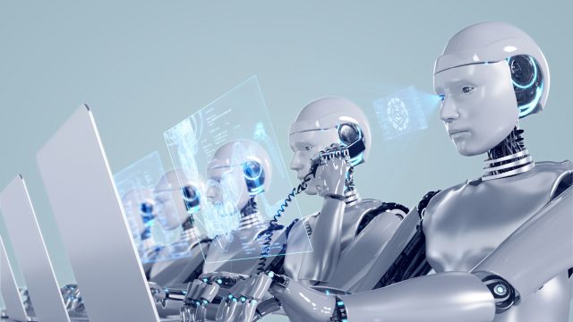 Đồ họa robot dùng máy tính và điện thoại trong văn phòng