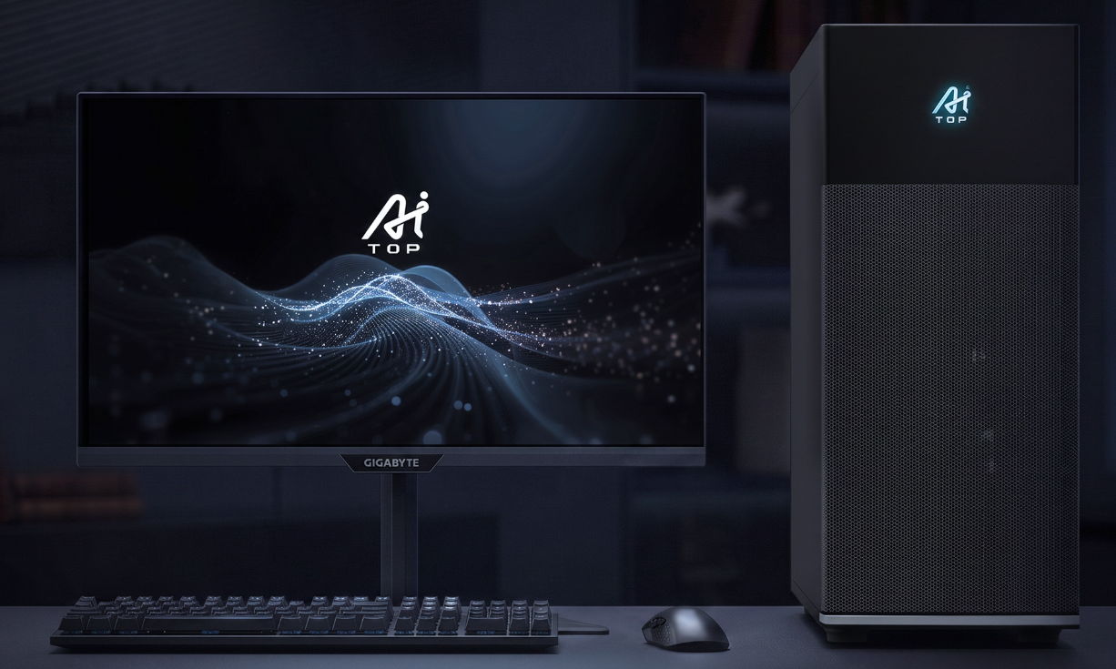 Bàn làm việc với thùng máy GIGABYTE AI TOP 100 B850 đặt cạnh màn hình hiển thị logo AI TOP.