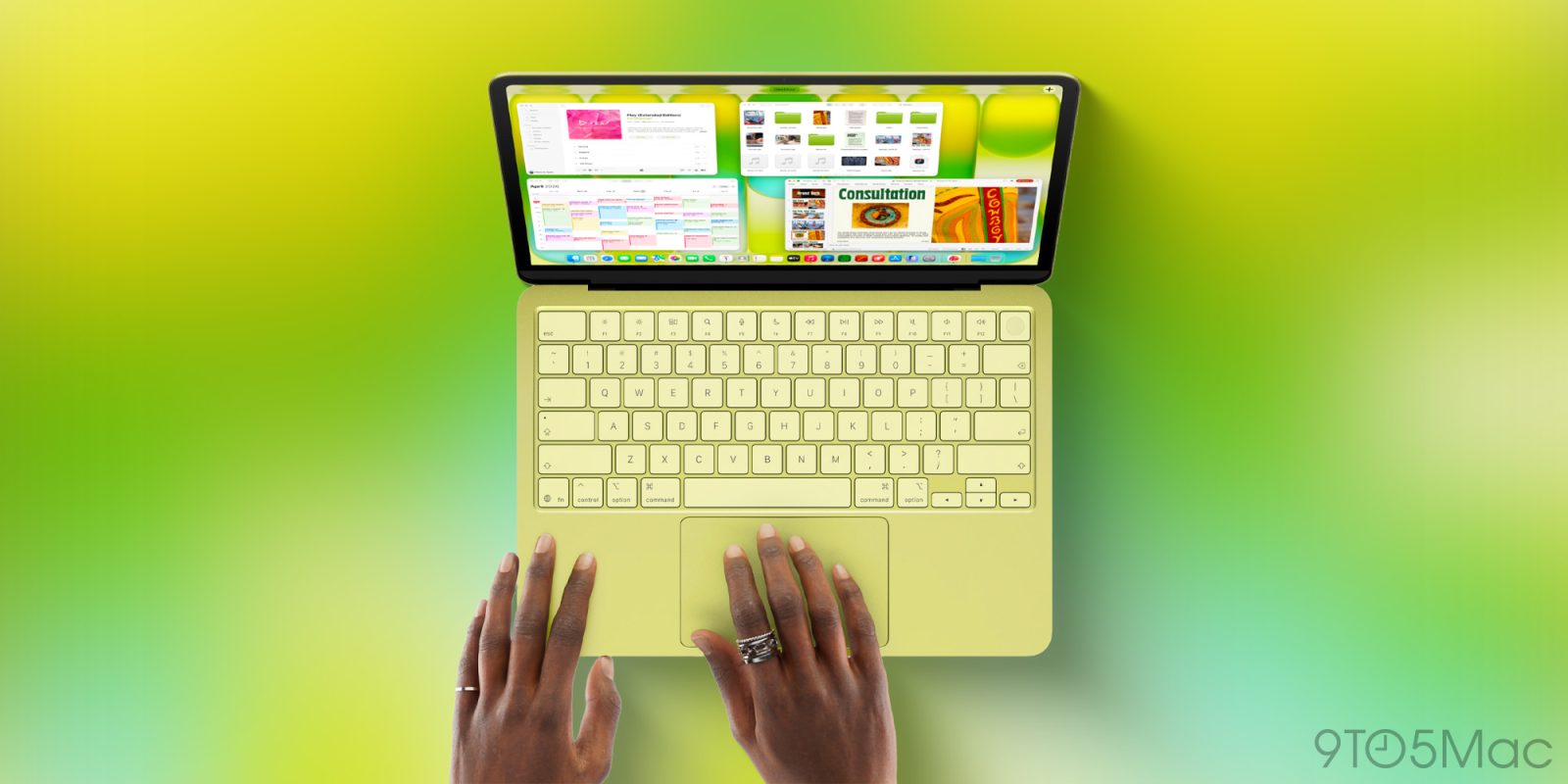 MacBook Neo màu vàng, nhìn từ trên xuống khi có người đang sử dụng bàn di chuột