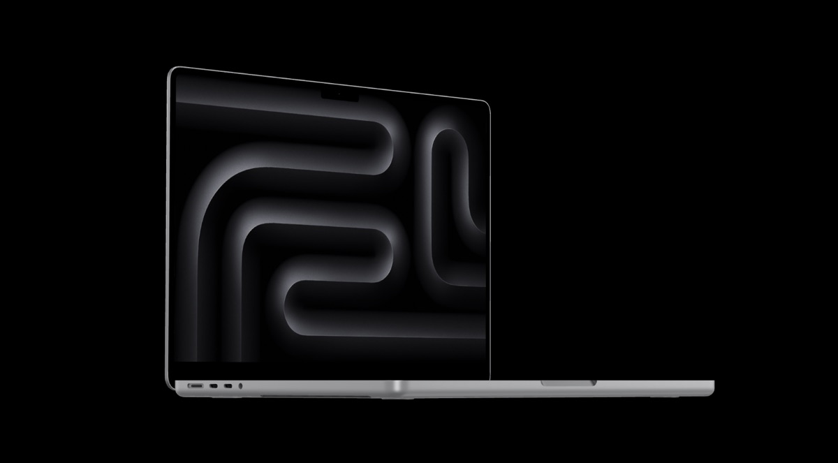 MacBook Pro với bàn phím và trackpad trên nền đen