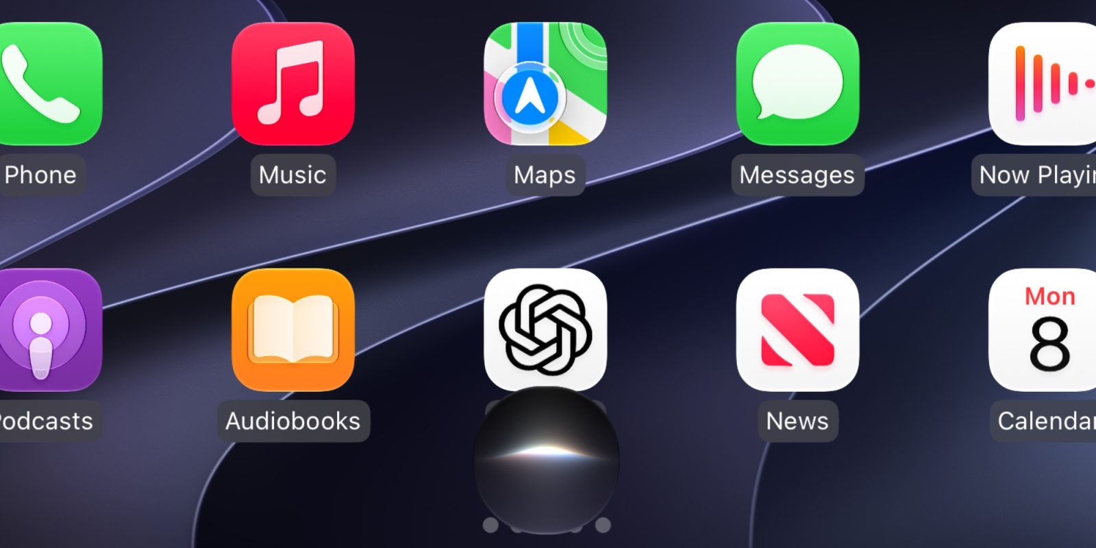 Màn hình chính CarPlay với lưới ứng dụng và nút Siri AI dạng quả cầu ở giữa đáy màn hình