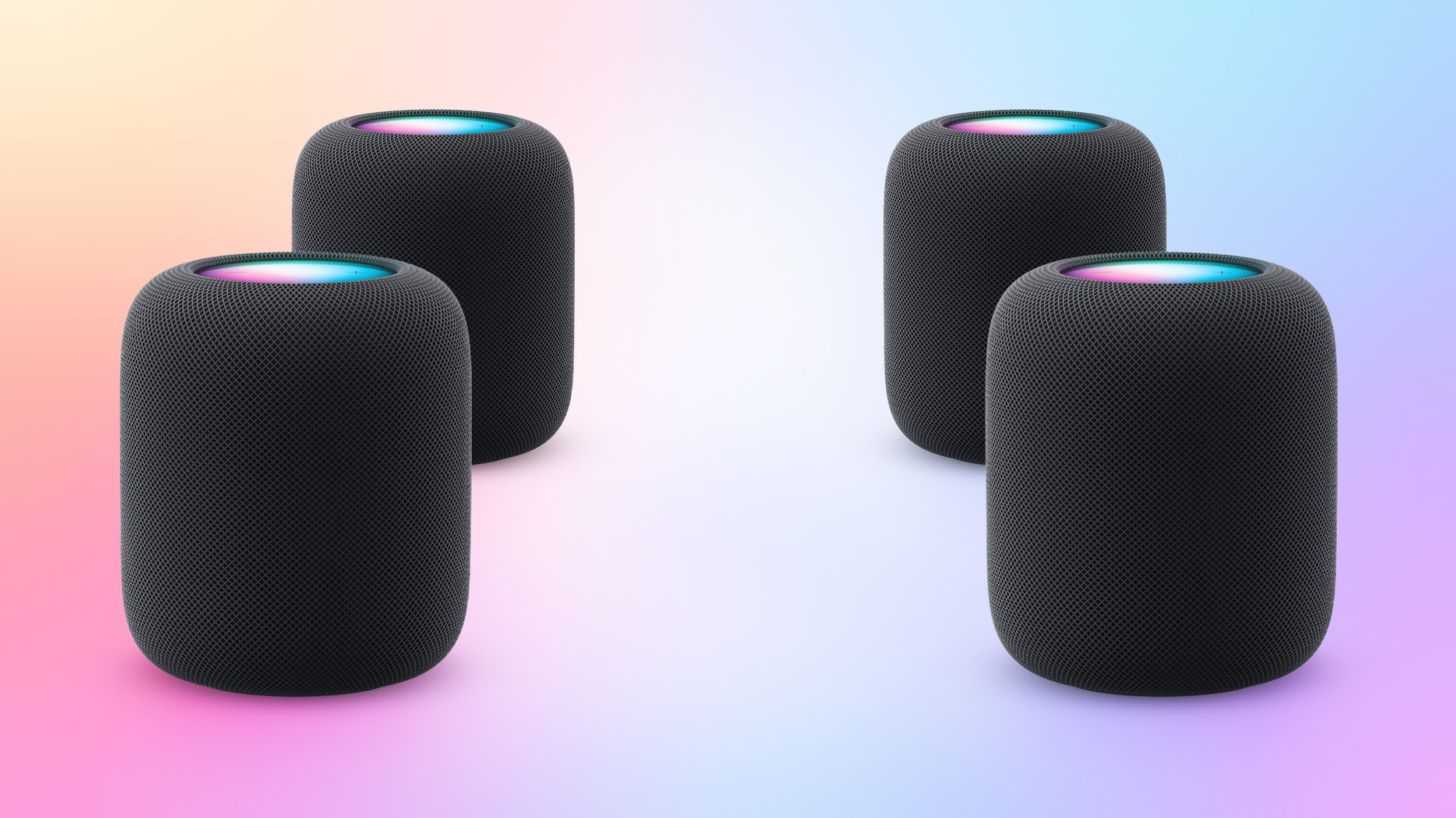 Render bốn loa HomePod xếp thành cặp trước và sau trong một căn phòng.