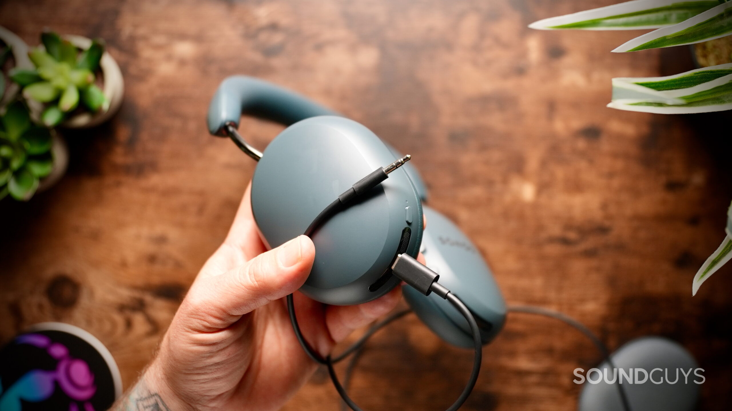 Sonos Ace Ultra headphones connected to the included USB-C to 3.5mm cable.