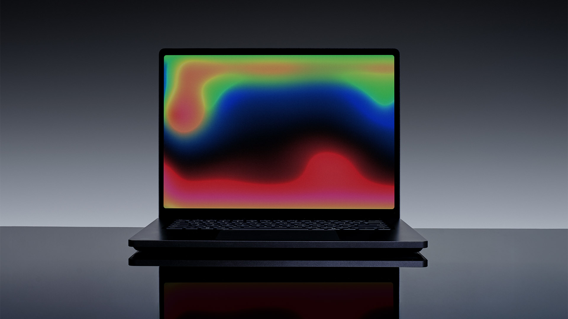 Surface Laptop Ultra mở màn hình hiển thị đồ họa trừu tượng.
