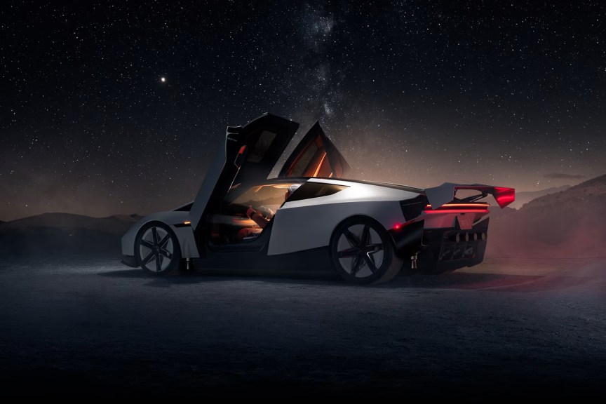 Tesla Roadster thế hệ hai với cửa mở kiểu cắt kéo dưới bầu trời đêm