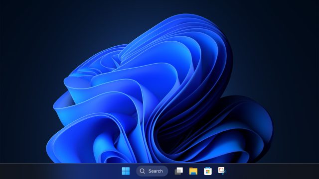 Thanh tác vụ Windows 11 với nút Start và ô Search trên nền xanh