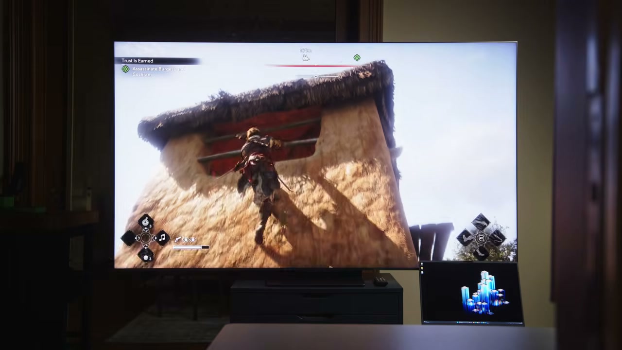 TV trong phòng khách hiển thị cảnh game ngoài trời có bầu trời sáng